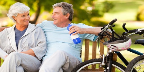 Elderly couple sitting on bench