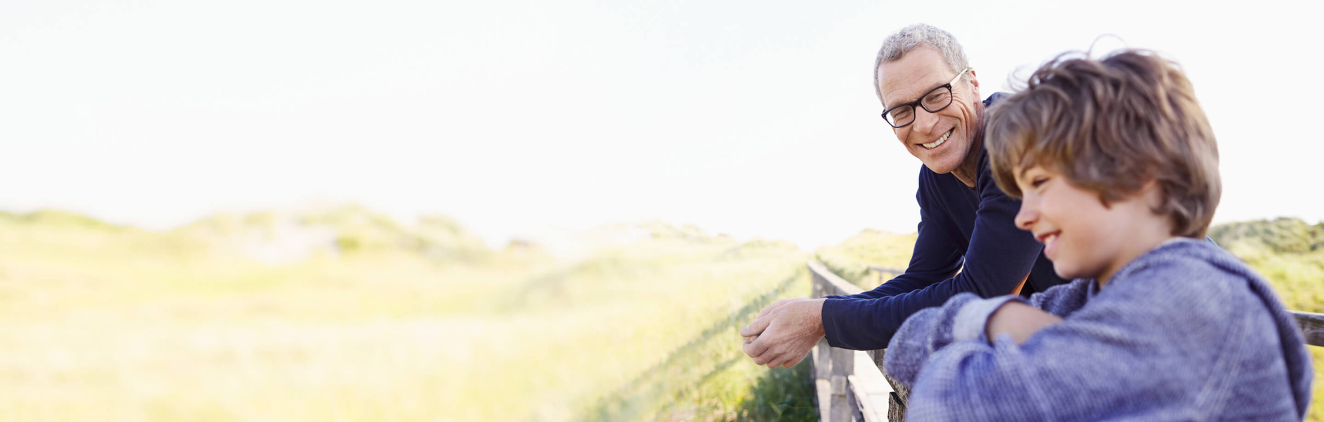 Father out in nature with his child smiling