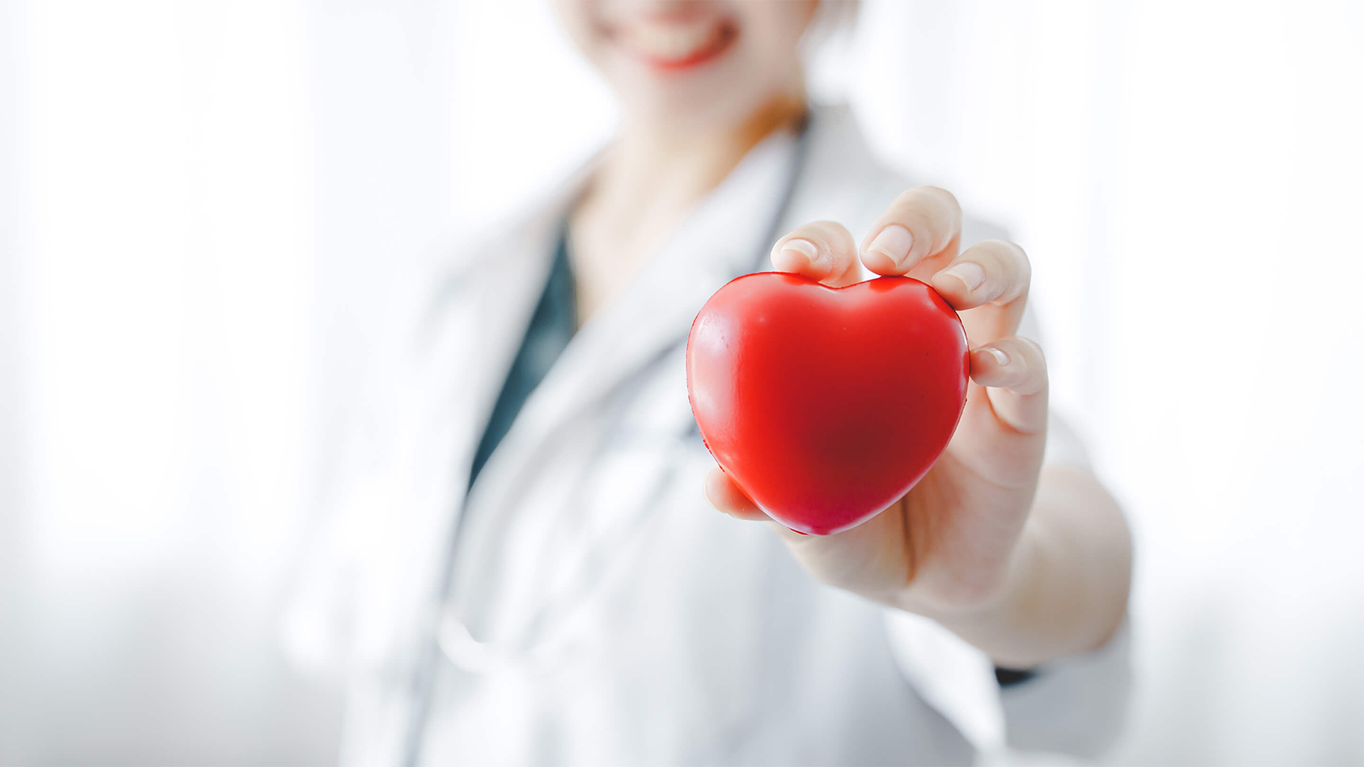 doctor holding toy heart
