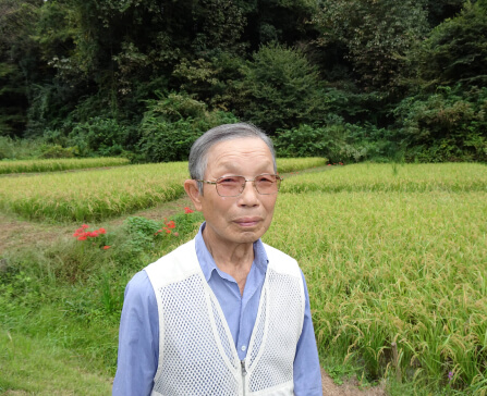 Mr. Muraki with specs in farm