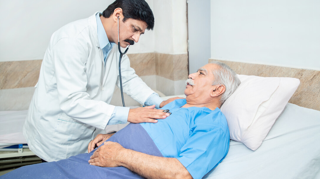 Doctor listening to patients heart