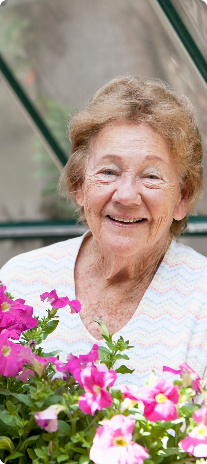 Old woman in white shirt smiling