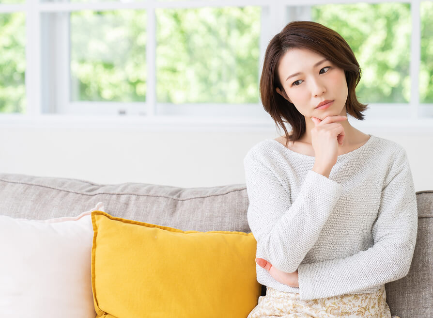 Lady in white thinking