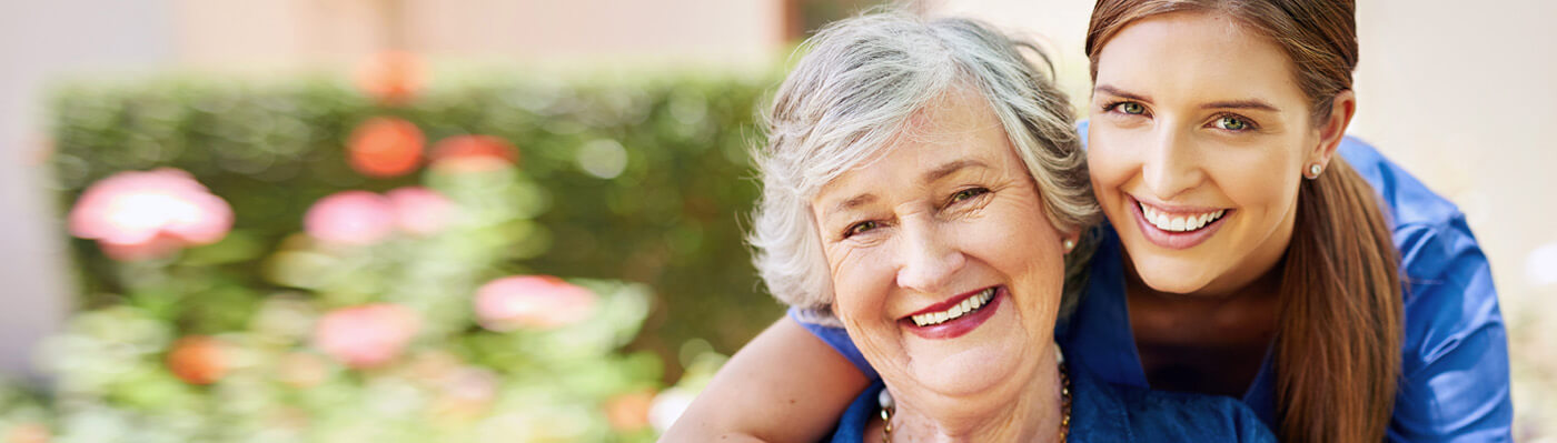 Woman hugging each other while laughing