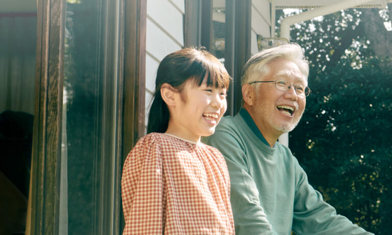 father and daughter smiling