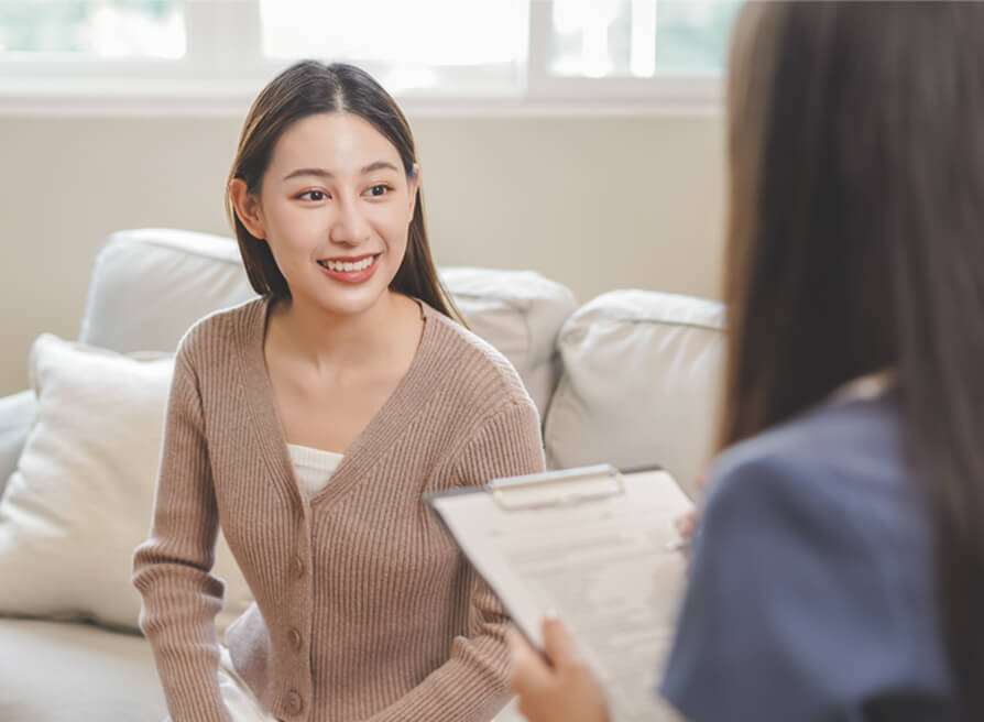 Lady in brown shirt smiling