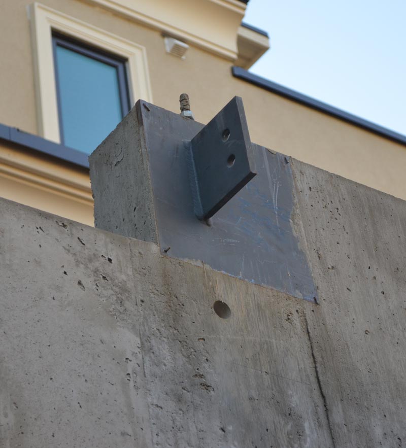 Shear plate connected to a corner embedded plate