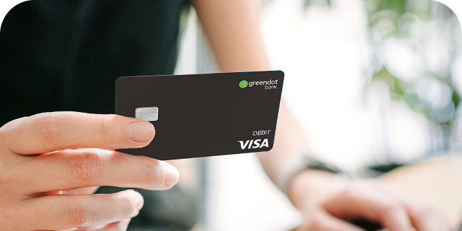 Green Dot™ Visa® Debit Card Holding up Green Dot™ Visa® Debit Card received at CheckSmart.