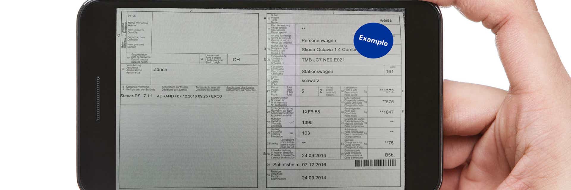 Hand that takes picture of vehicle registration with smartphone