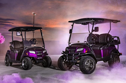 Two purple Twilight Club Car special edition golf carts