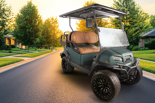 A green Club Car Onward special edition parked outside in a neighborhood