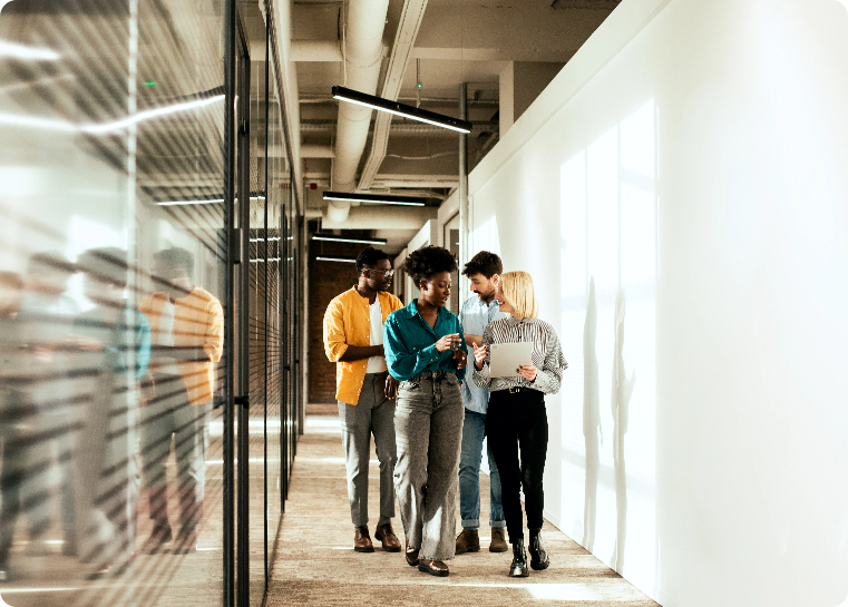 Group of colleagues walking down an office hallway at CPA Firm