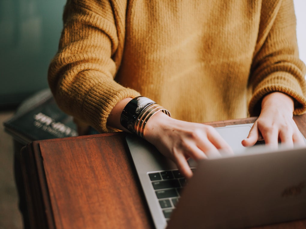 Potential donor filling in online form on a laptop.  Potential donor filling in online form on a laptop.