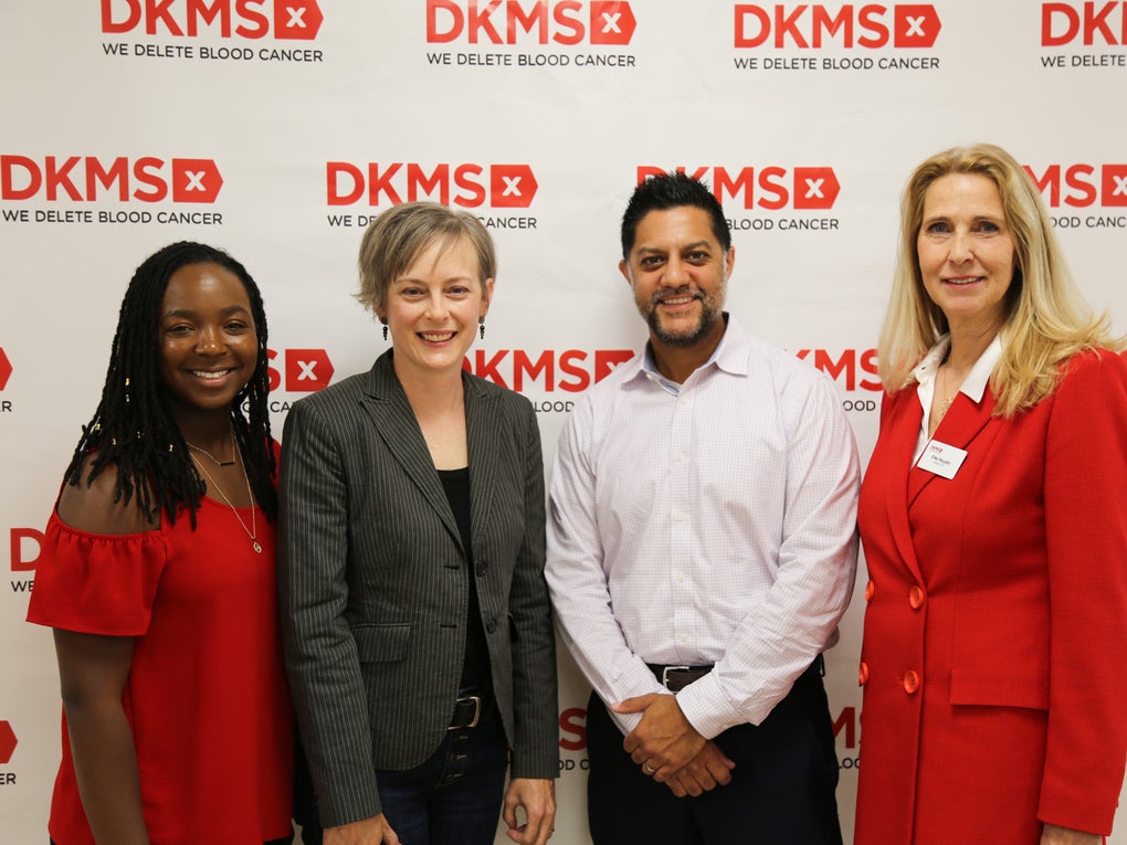 DKMS stem cell donor, Jasmine Thompson, Transplant recipient, Kristi Martin, Transplant Physician, Dr. Nilay Shah, and DKMS Global CEO, Dr. Elke Neujahr standing in front of a DKMS logo banner at the Charlotte Media event. DKMS stem cell donor, Jasmine Thompson, Transplant recipient, Kristi Martin, Transplant Physician, Dr. Nilay Shah, and DKMS Global CEO, Dr. Elke Neujahr standing in front of a DKMS logo banner at the Charlotte Media event.