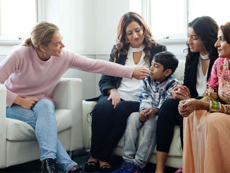 Katharina Harf meeting with a patient and their family Katharina Harf meeting with a patient and their family