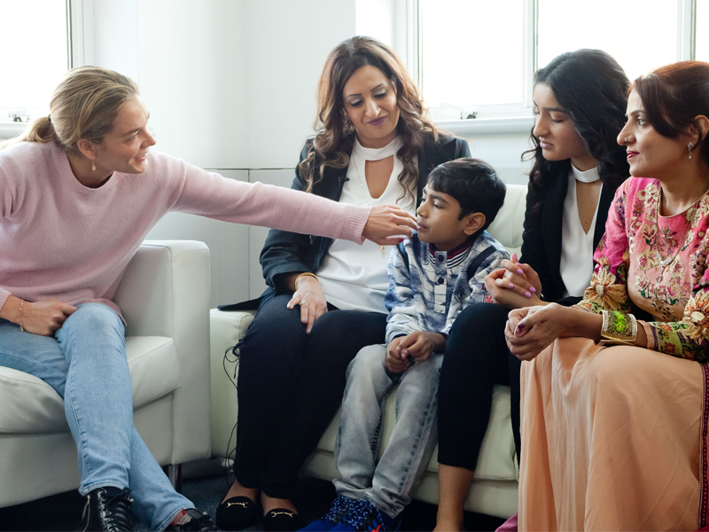 Katharina Harf meeting with a patient and their family Katharina Harf meeting with a patient and their family