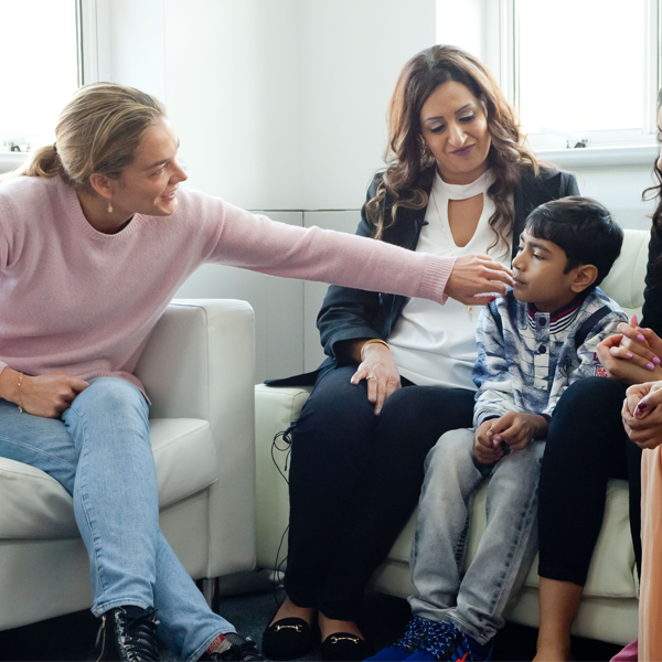 Katharina Harf meeting with a patient and their family Katharina Harf meeting with a patient and their family