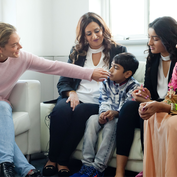 Katharina Harf meeting with a patient and their family Katharina Harf meeting with a patient and their family
