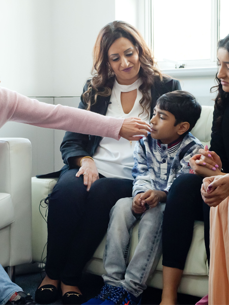 Katharina Harf meeting with a patient and their family Katharina Harf meeting with a patient and their family