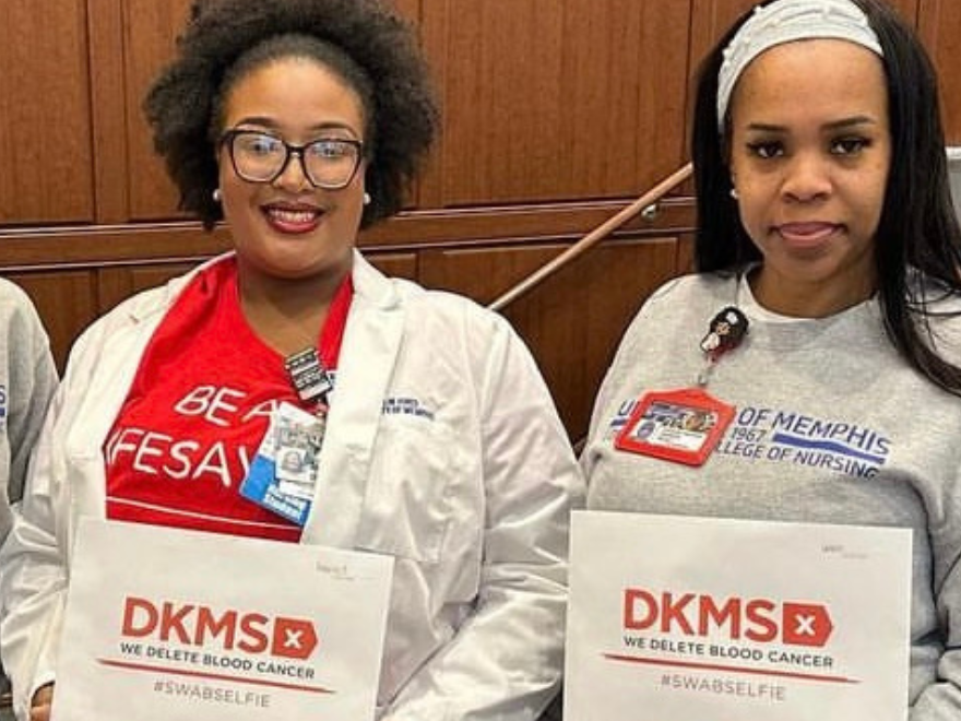 Three nursing students from the University of Memphis smile while holding DKMS registration packets. Three nursing students from the University of Memphis smile while holding DKMS registration packets.