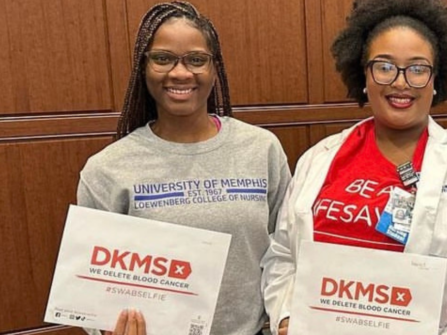 Three nursing students from the University of Memphis smile while holding DKMS registration packets. Three nursing students from the University of Memphis smile while holding DKMS registration packets.