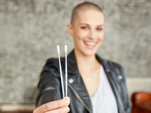 Dana donor holding 2 swabs Dana donor holding 2 swabs