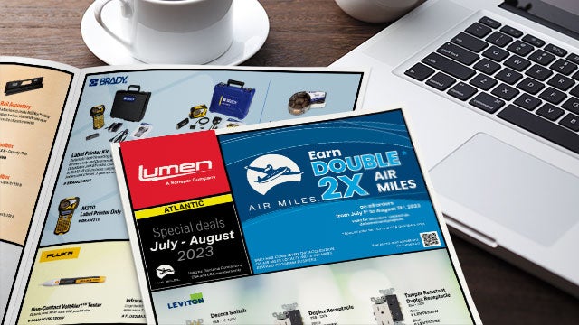 Lumen.ca 's July-August 2023 promotional flyers for Atlantic in front of a computer and a cup of coffee