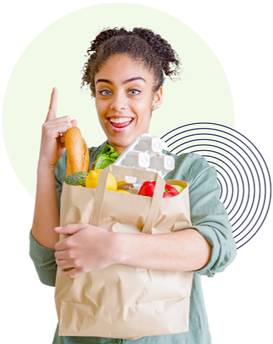 A lady holding a bag of groceries