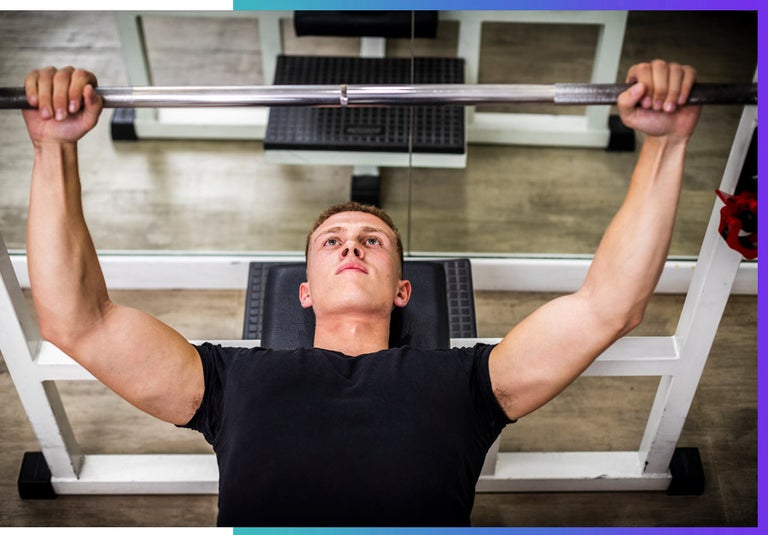A man spotting himself at the gym.
