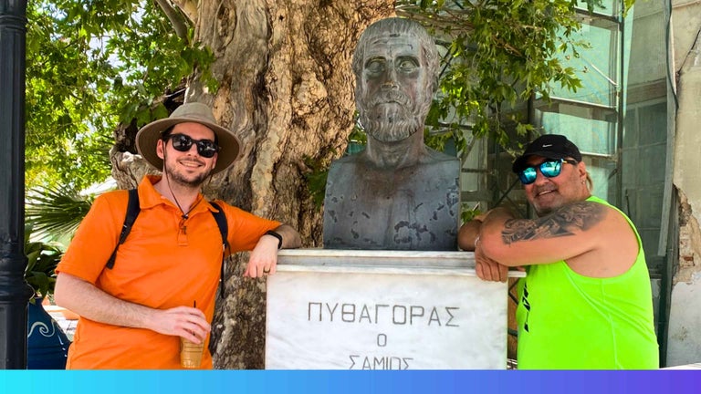 Matthew and his Turkish father-in-law standing at the statue of Pythagoras on summer holiday.