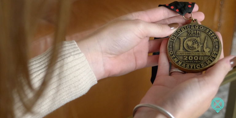 Tristan showing her Chicago Gymnastics medal