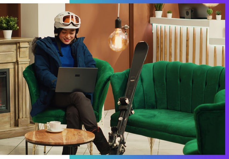 A HENRY remote worker gearing up to ski as she works and travels the world.