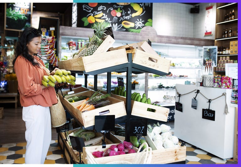 A woman assesses grocery prices at her local store. Inflation.
