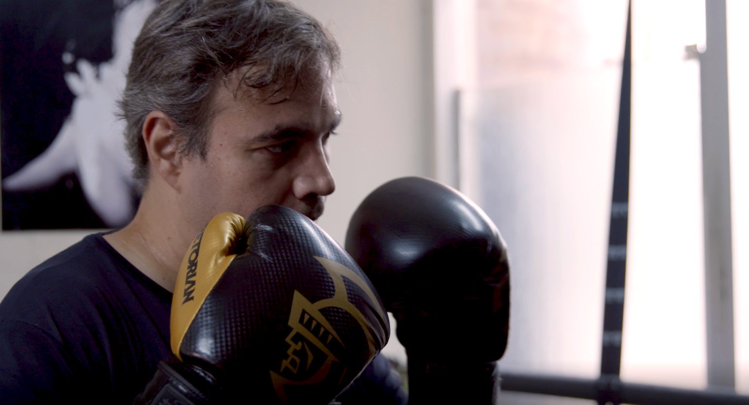 Fabiano boxing at a Brazilian studio in the city.