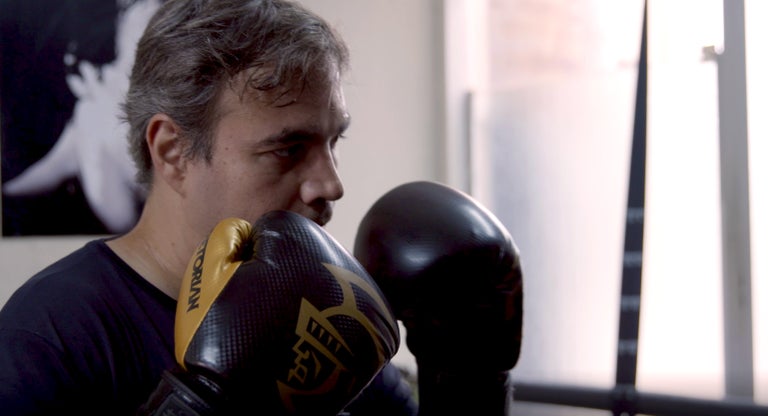 Fabiano boxing at a Brazilian studio in the city.