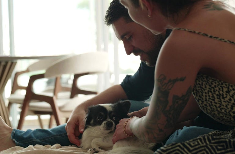 Gui Colombo and his wife and small dog.