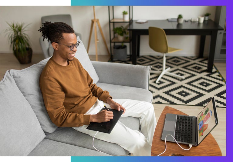 A neurodiverse man working from home happily. 