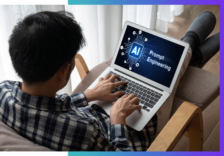 A man prompt engineering on his home laptop.