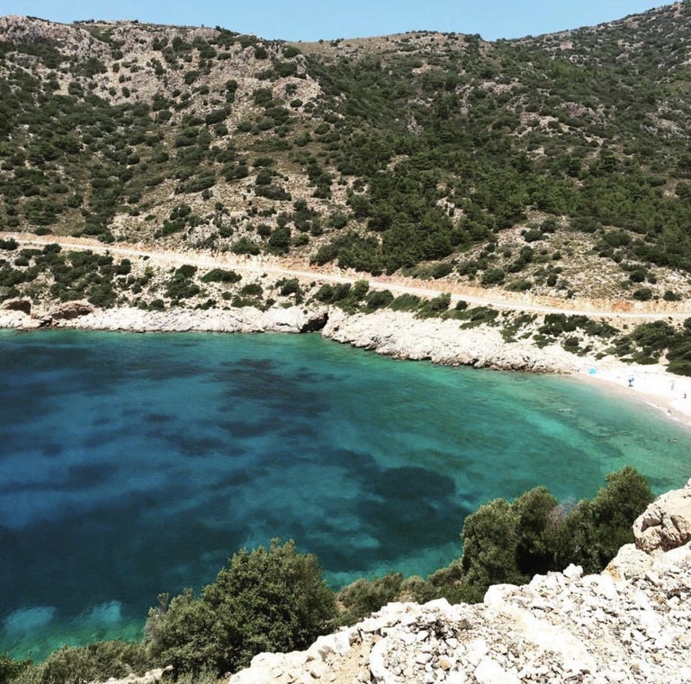 Aerial view of a scenic coastal landscape with clear turquoise waters