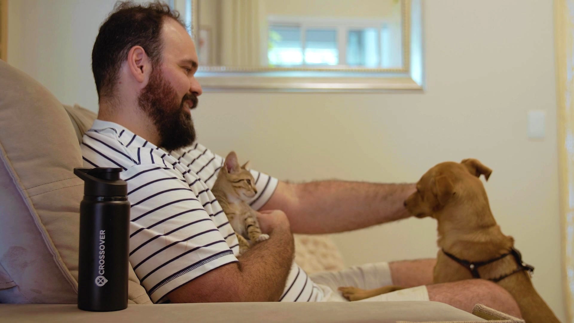 Manuel Da Silva at home with his dog and cat. 