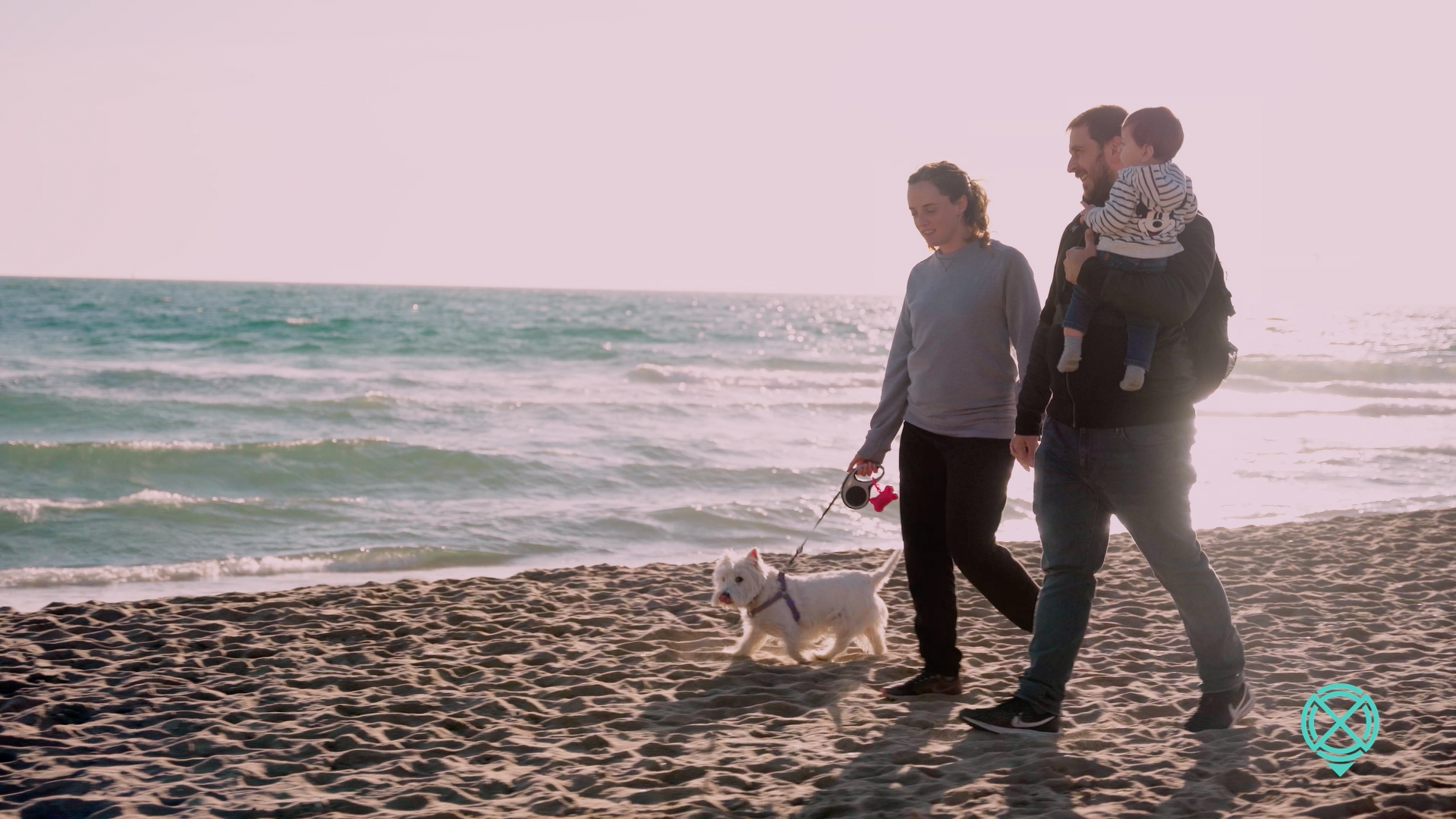 Gisela walking along the beach in Barcelona with her family