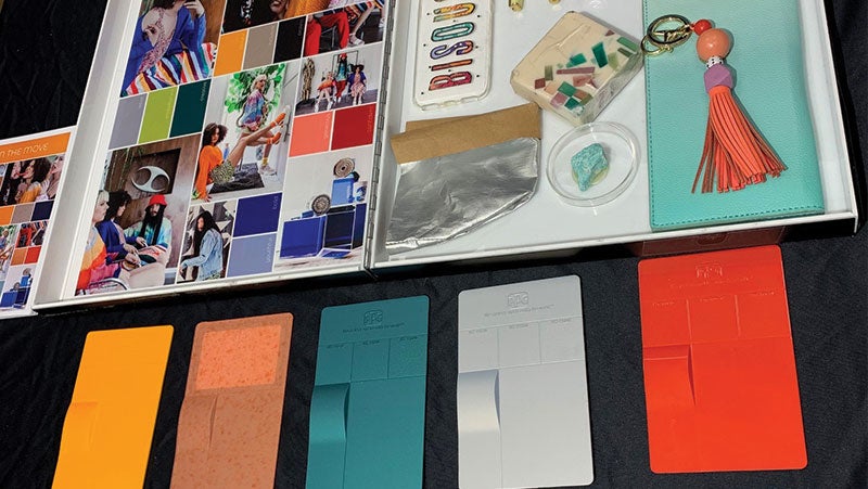 Color swatches for PPG's consumer electronics coatings with a mood board used to inform the cutting-edge color styling.