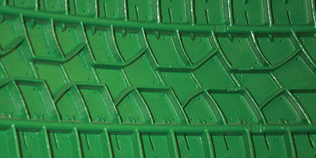 Close-up of a green tyre mold which offers superb release with PPG nonstick coatings.