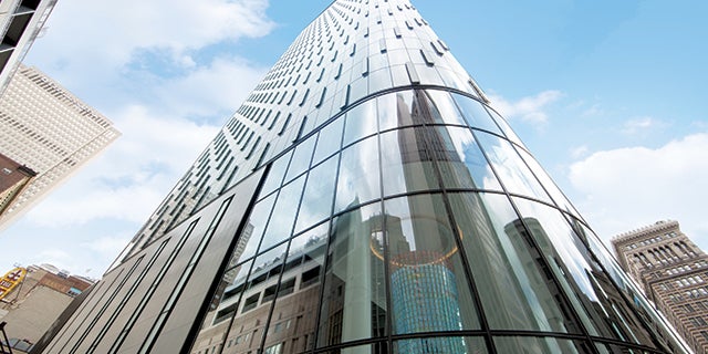 Worm's eye view of PNC Plaza in Pittsburgh, Pennsylvania – a glass-and-steel skyscraper.