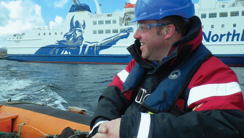 Gareth Berry, PPG industrial coatings' European market specialist, on a boat towards PPG's live marine test site in the North Sea.