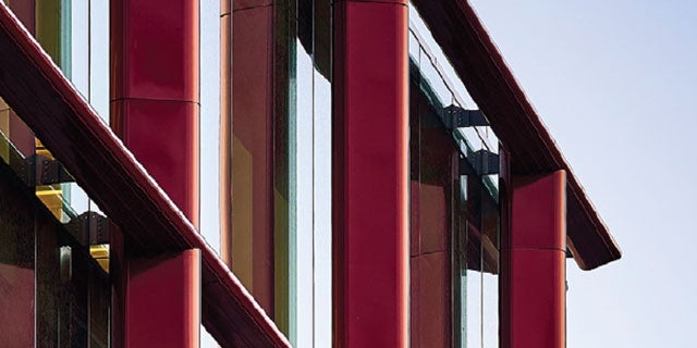 Close-up cladding of the Bulletin Building uses a deep cherry PPG powder coating with sparkling effect
