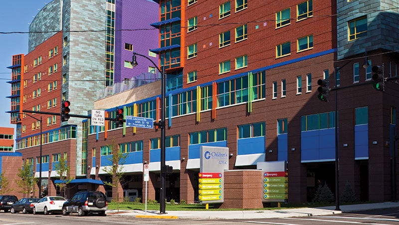 Exterior of Children's Hospital of Pittsburgh showing colorful coatings used in blue, green, orange, yellow and purple.