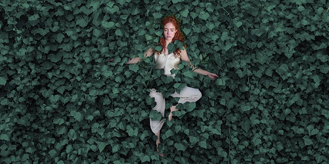 Girl surrounded by Vining Ivy
