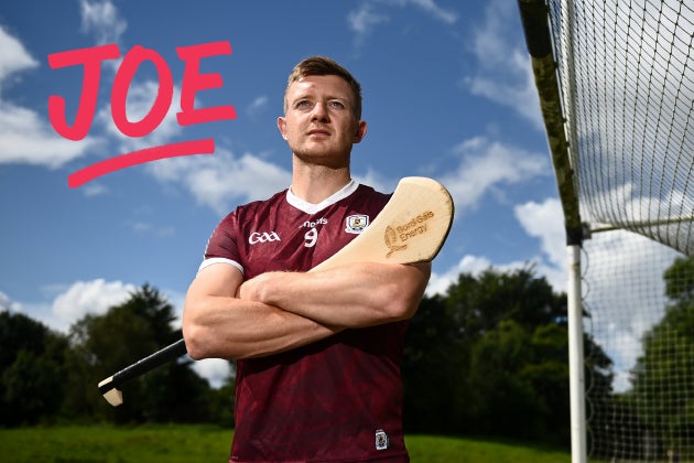 Joe Canning standing beside a goal with a hurl