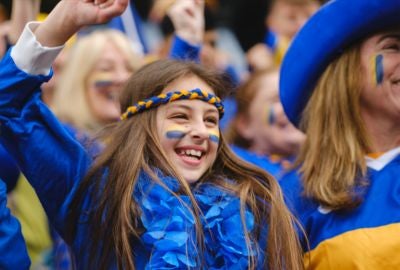 Fan cheering on her team